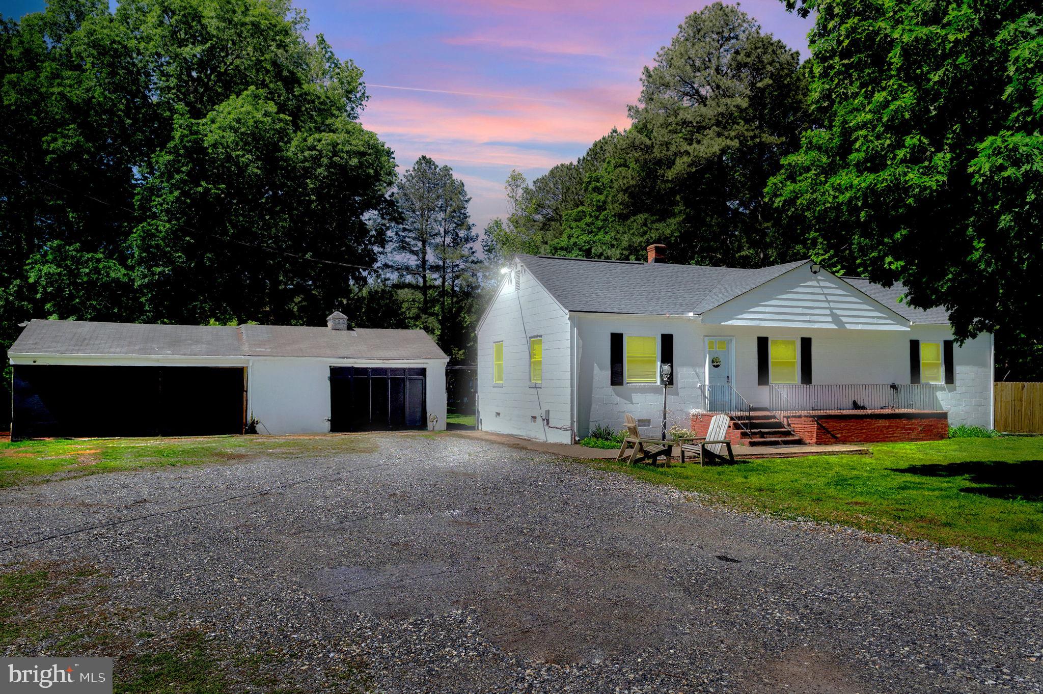 10439 Ashcake Road Ashland, VA 23005 - Photo 2 of 27 a front view of house with yard and green space