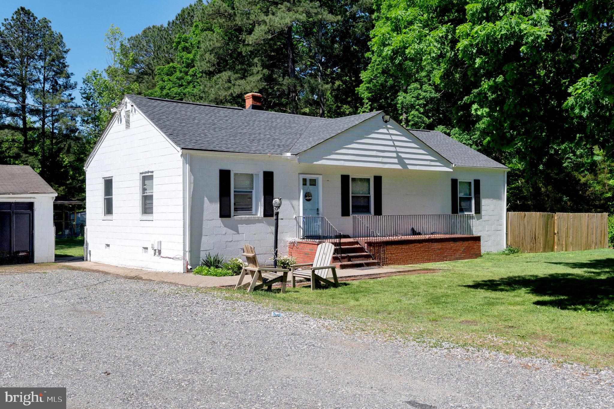 10439 Ashcake Road Ashland, VA 23005 - Photo 3 of 27 a front view of house with yard and outdoor seating