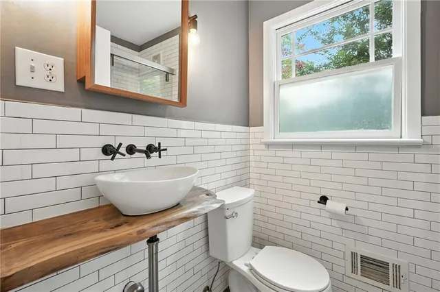 a bathroom with a toilet and a sink