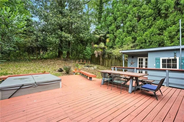 swimming pool view with a seating space