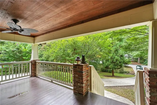 a view of balcony with a large window and wooden floor