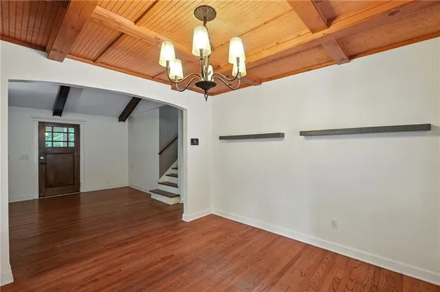 a kitchen with a refrigerator and a stove top oven
