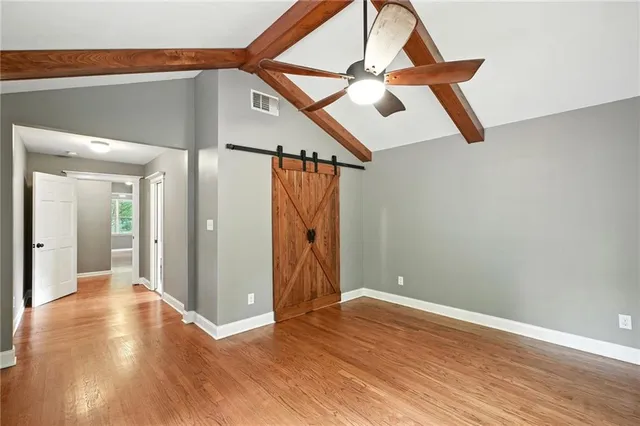 a view of an entryway with wooden floor