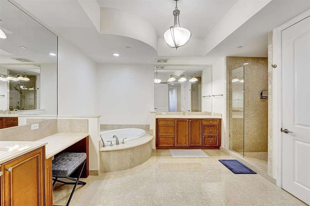 1 North Ocean Boulevard, Unit 403 Boca Raton, FL 33432 - Photo 13 of 46 a large spacious bathroom with a large tub shower and sink