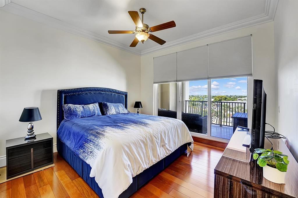 1 North Ocean Boulevard, Unit 403 Boca Raton, FL 33432 - Photo 15 of 46 a bedroom with a bed and a large window