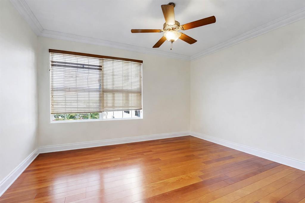 1 North Ocean Boulevard, Unit 403 Boca Raton, FL 33432 - Photo 21 of 46 an empty room with a window and a fan