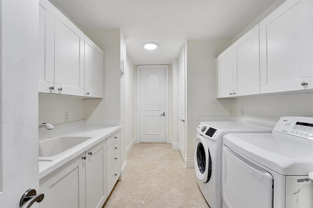 1 North Ocean Boulevard, Unit 403 Boca Raton, FL 33432 - Photo 23 of 46 a view of storage and utility room with washer and dryer