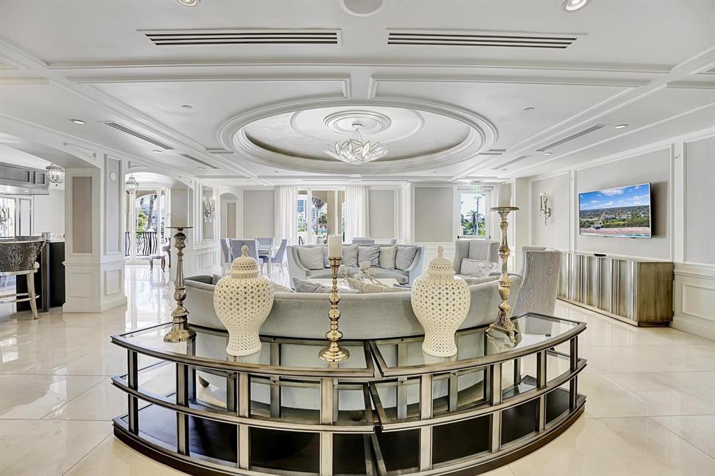 1 North Ocean Boulevard, Unit 403 Boca Raton, FL 33432 - Photo 26 of 46 a view of a dining room with furniture and a chandelier