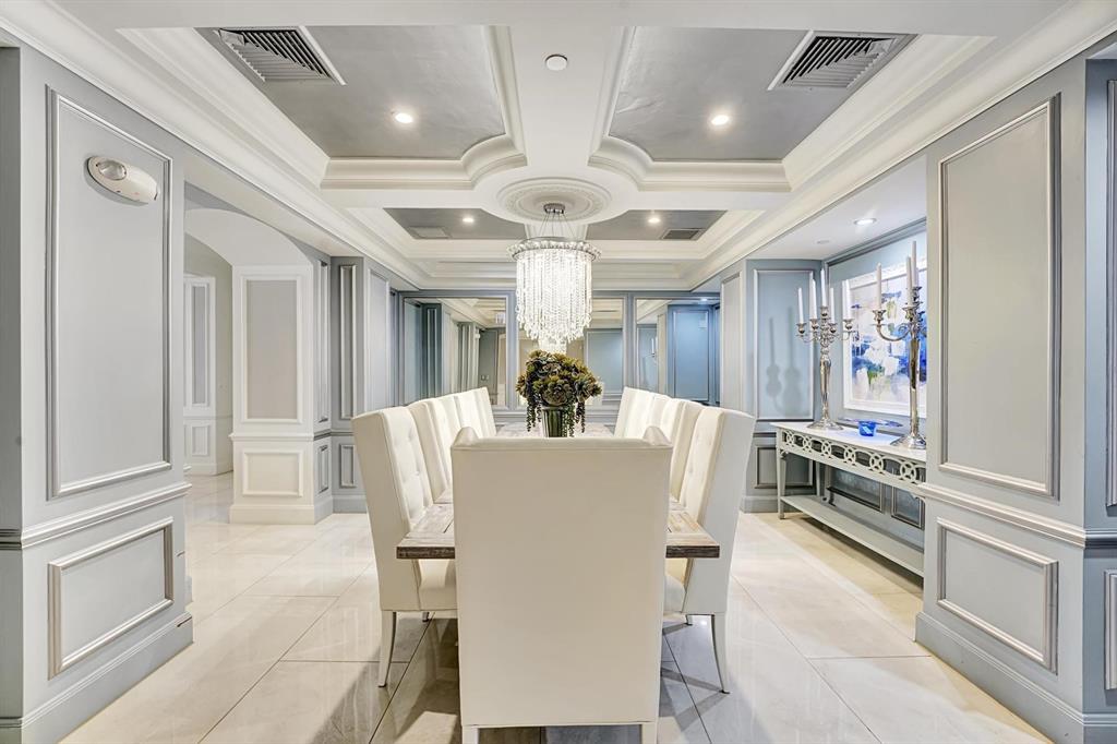 1 North Ocean Boulevard, Unit 403 Boca Raton, FL 33432 - Photo 28 of 46 a view of a dining room with furniture large window and chandelier