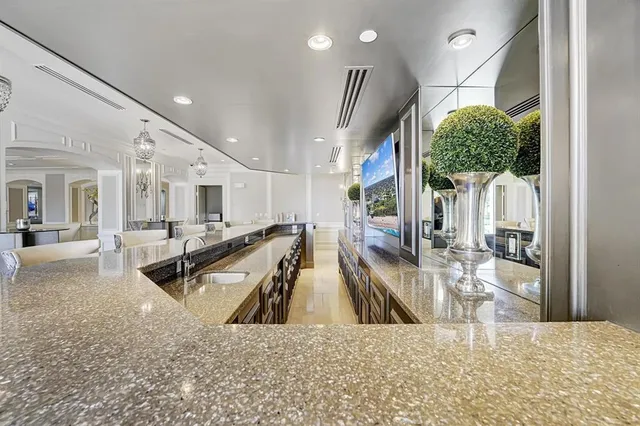 a view of a living room and kitchen