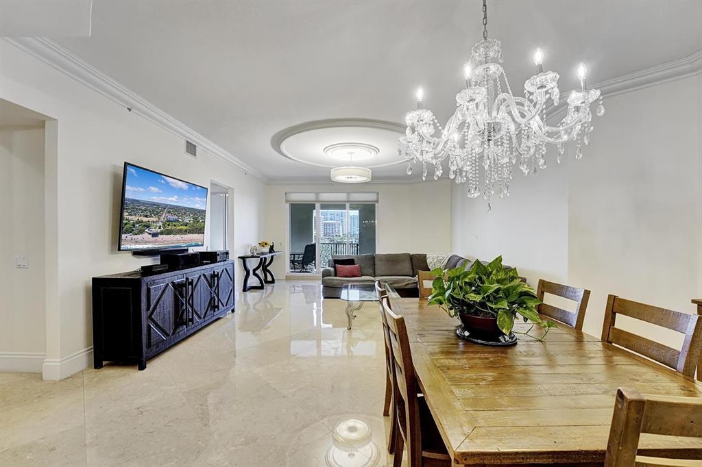 1 North Ocean Boulevard, Unit 403 Boca Raton, FL 33432 - Photo 4 of 46 a living room with furniture and a flat screen tv