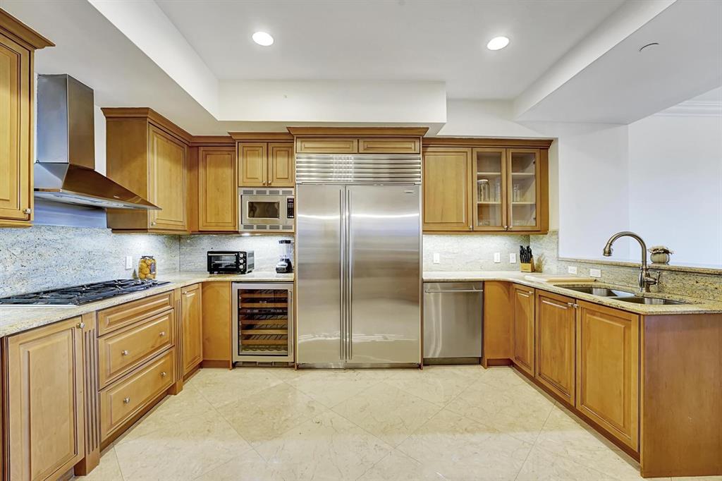 1 North Ocean Boulevard, Unit 403 Boca Raton, FL 33432 - Photo 6 of 46 a kitchen with stainless steel appliances granite countertop a sink a stove and refrigerator