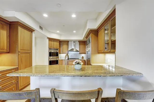 a kitchen with dining table and chairs