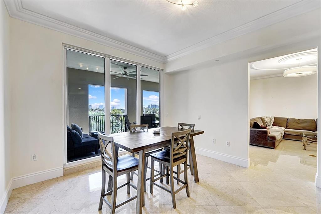 1 North Ocean Boulevard, Unit 403 Boca Raton, FL 33432 - Photo 9 of 46 a dining room with furniture and window