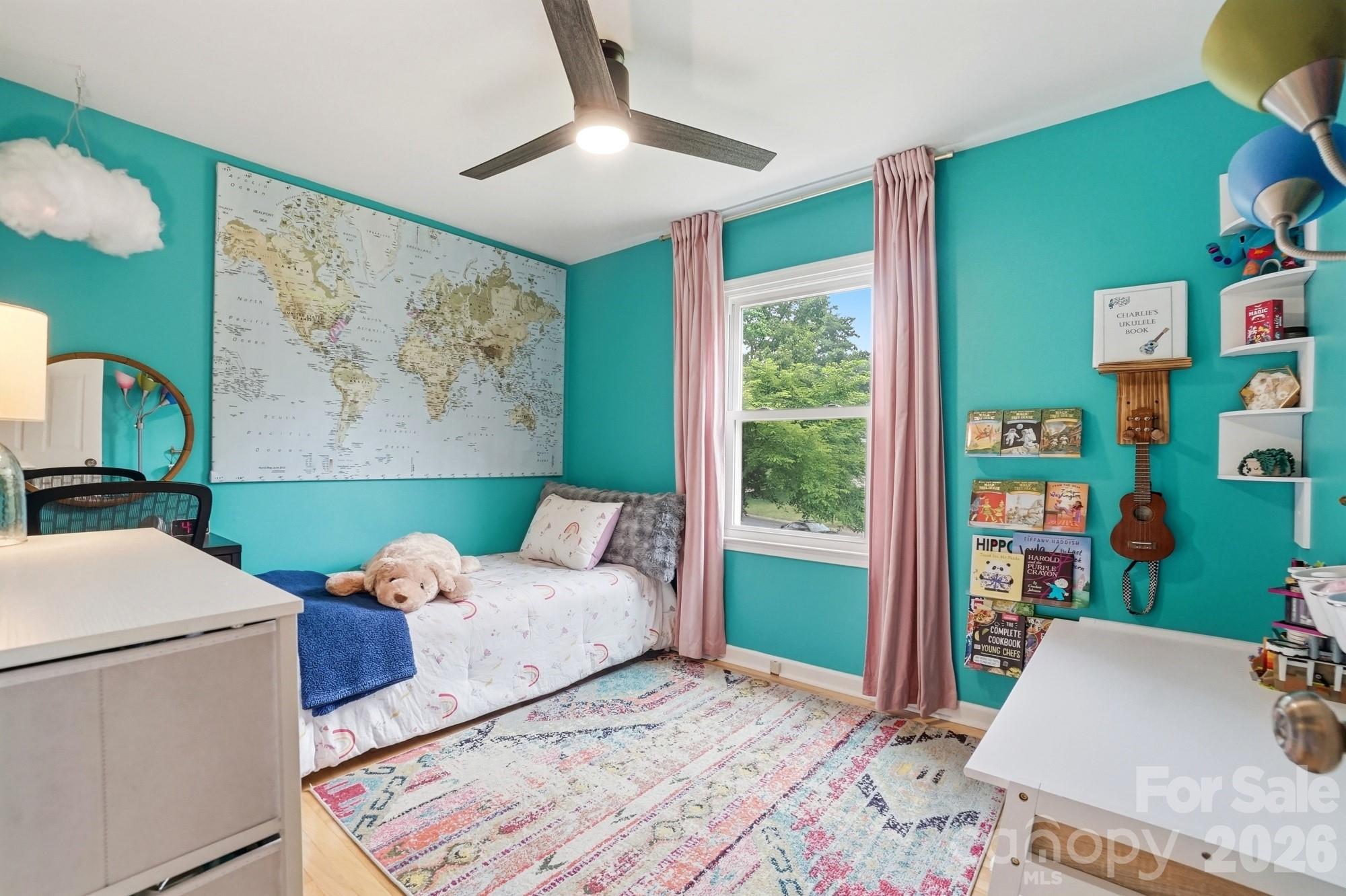 824 Riverwood Road Charlotte, NC 28270 - Photo 16 of 37 a bed sitting in a bedroom next to a window