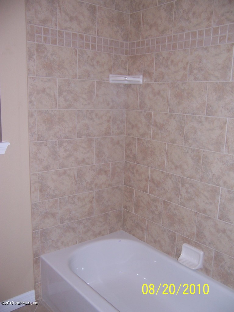 2003 E Road Jacksonville, FL 32216 - Photo 24 of 30 new tub with tiled walls