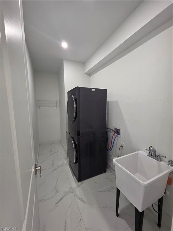 331 Nelson Road North Cape Coral, FL 33993 - Photo 8 of 29 Hallway featuring large format marble-look tile flooring, white interior doors, and recessed lighting