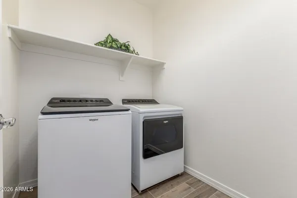 a utility room with washer and dryer