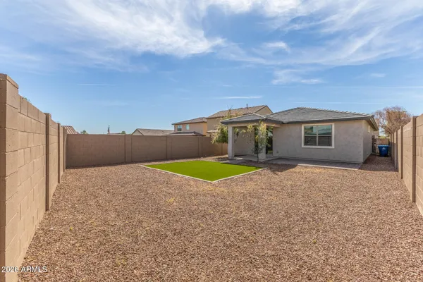 a view of a house with a yard and garage