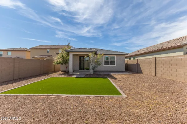 a view of a house with pool yard and a patio