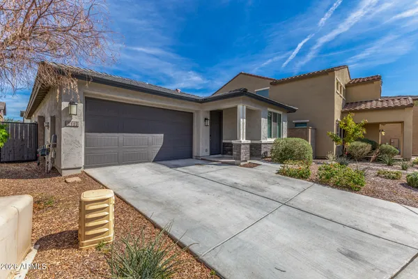 a front view of a house with garage