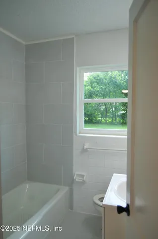 a bathroom with a bathtub