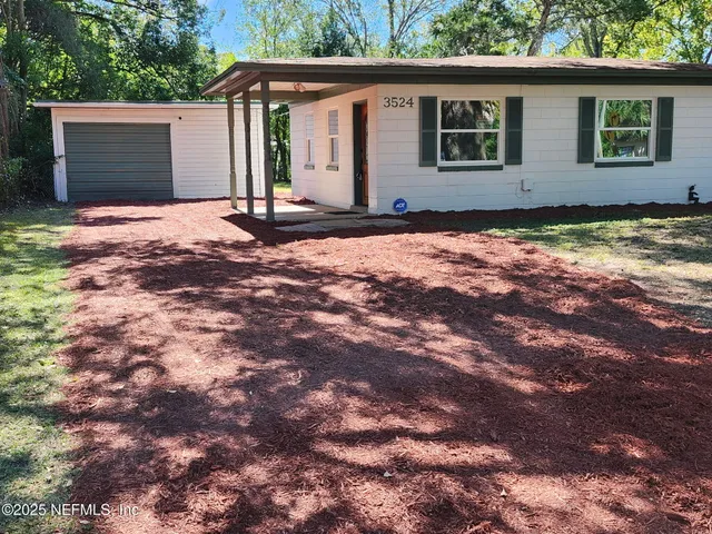 a house with yard in front of it