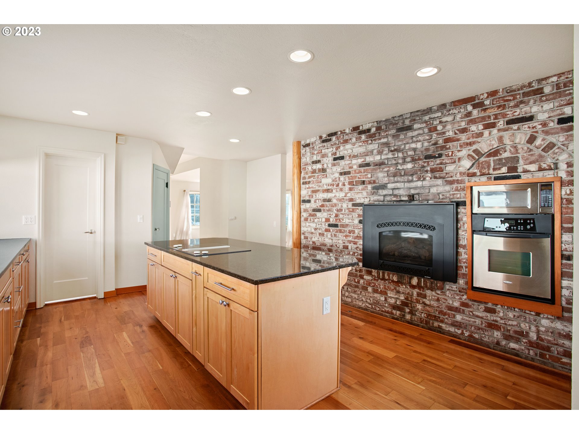 125 South Main Avenue Ridgefield, WA 98642 - Photo 13 of 35 a kitchen with granite countertop a stove top oven and sink