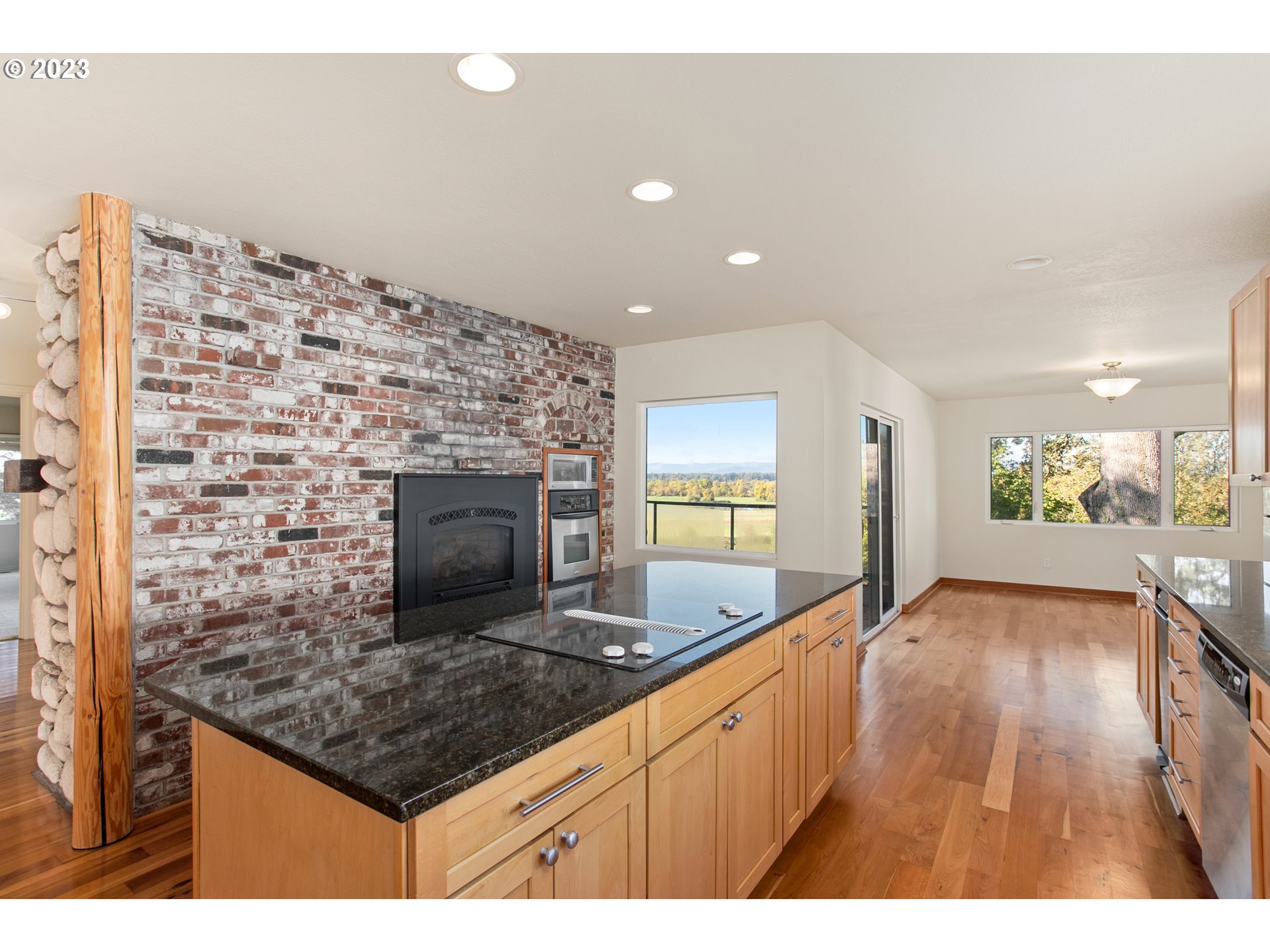125 South Main Avenue Ridgefield, WA 98642 - Photo 15 of 35 a kitchen with a sink and a fireplace