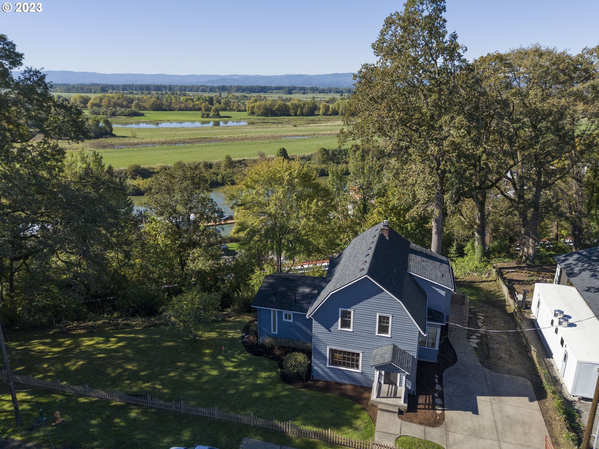 125 South Main Avenue Ridgefield, WA 98642 - Photo 3 of 35 a view of a house with a lake view