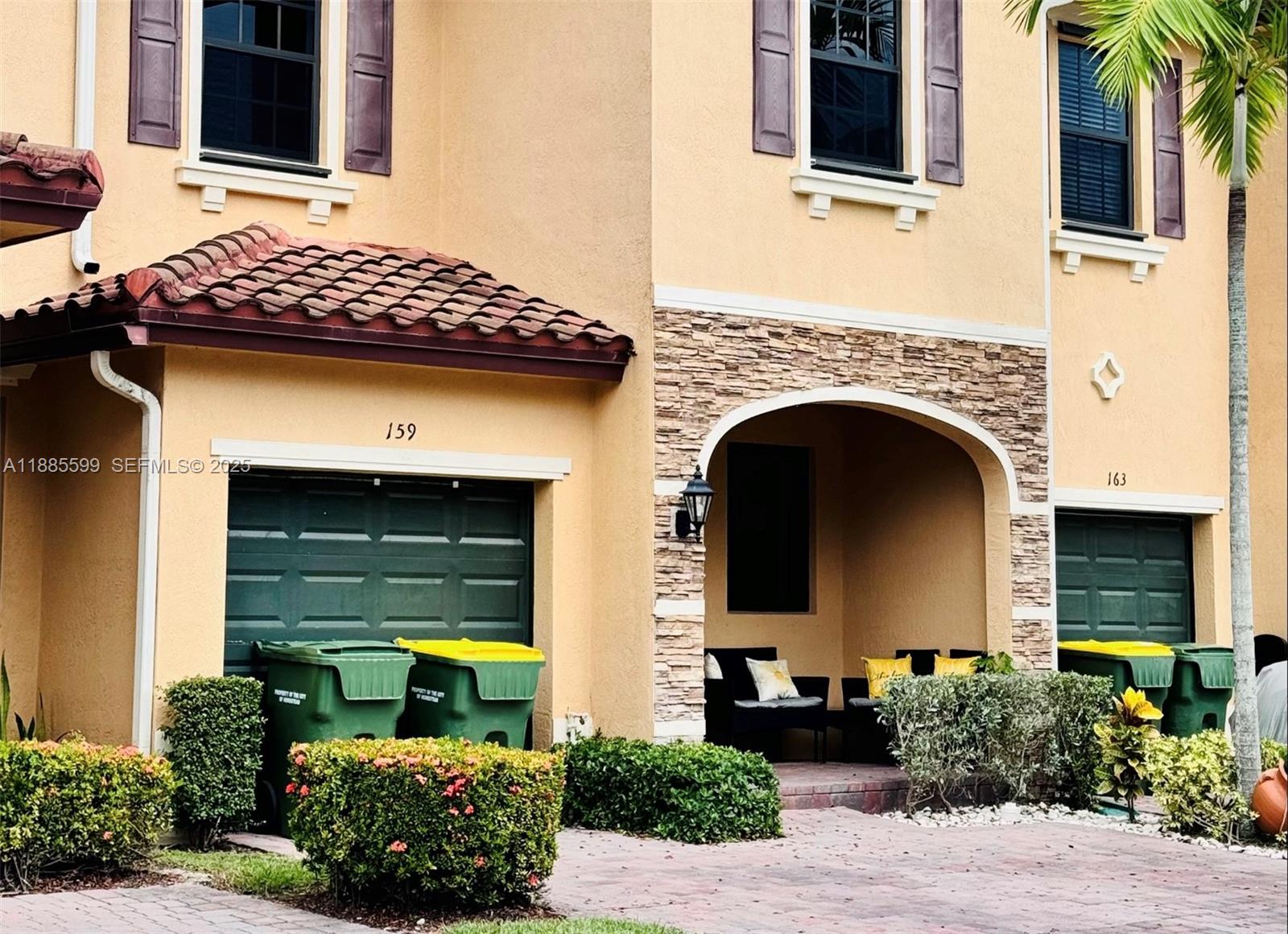 a front view of a house with garden