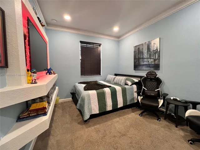 a bedroom with a bed and furniture