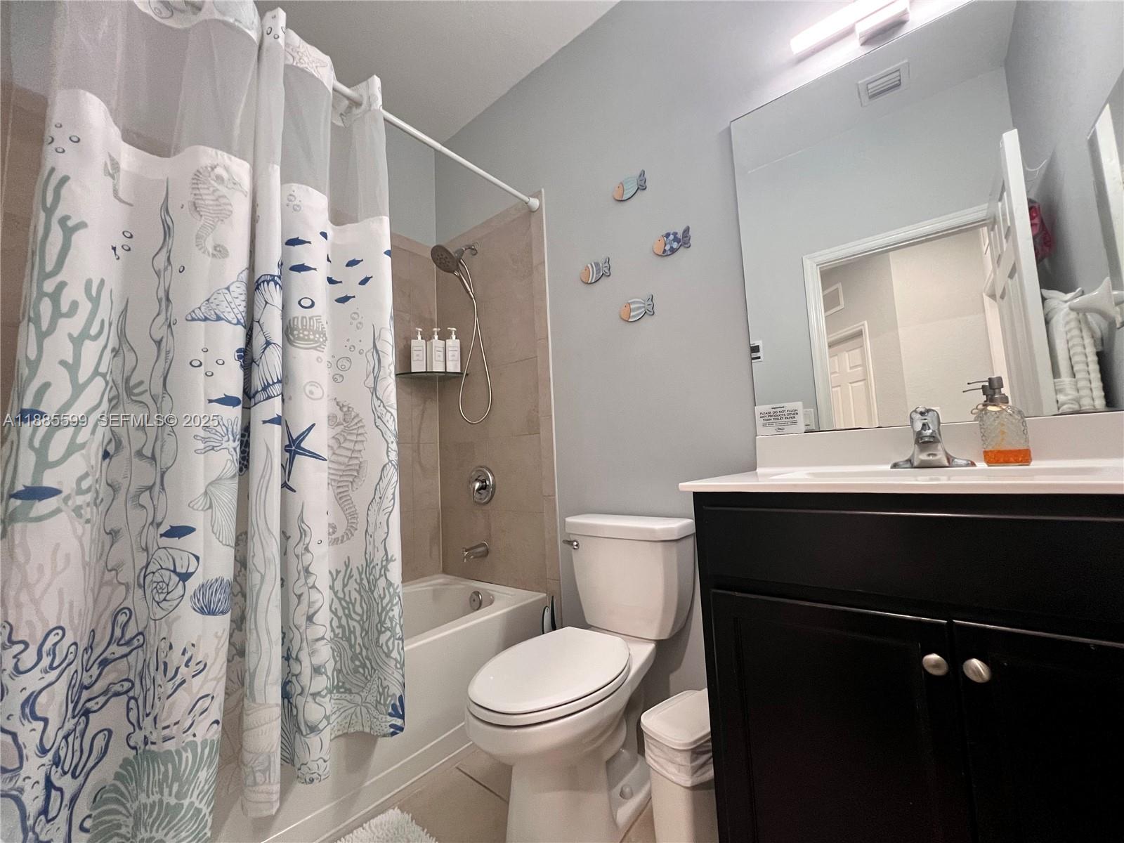 159 Southeast 34th Avenue Homestead, FL 33033 - Photo 16 of 27 a bathroom with a sink toilet and shower