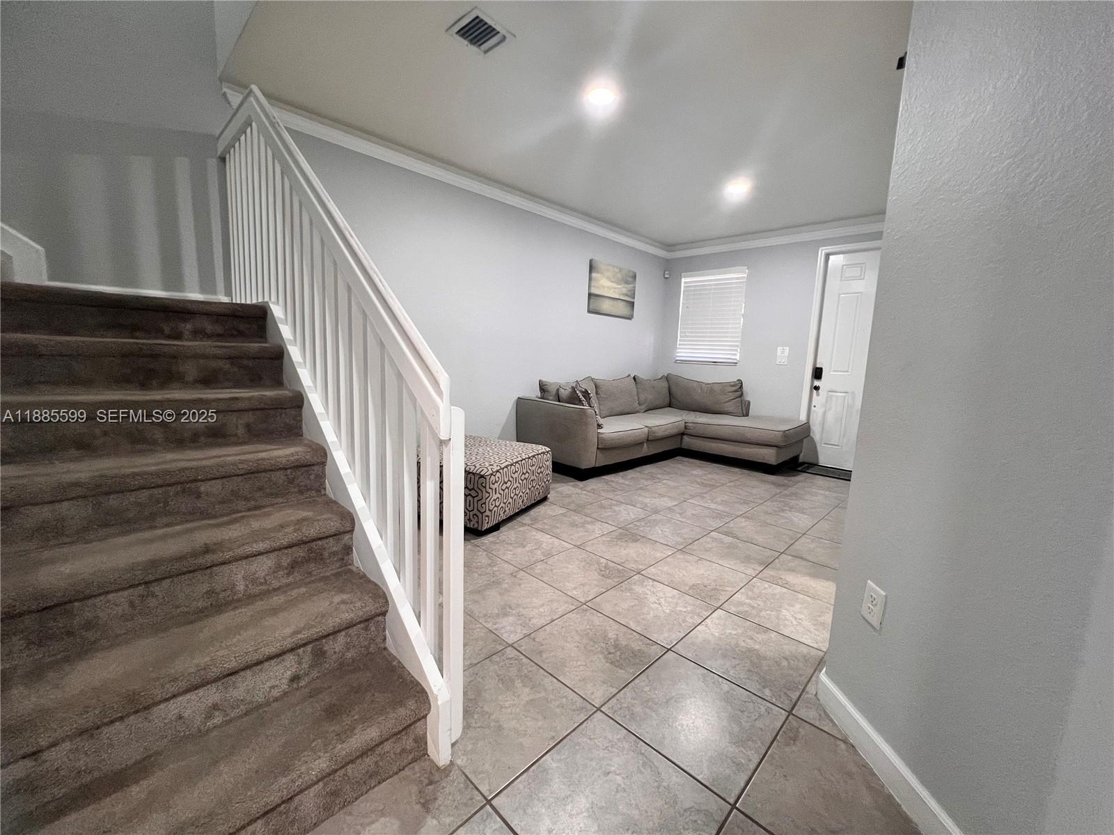 159 Southeast 34th Avenue Homestead, FL 33033 - Photo 20 of 27 a living room with furniture and stairs