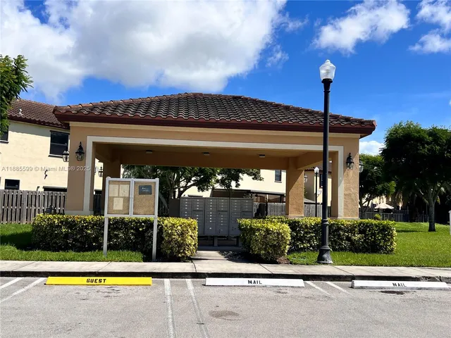 a view of a building with a garden