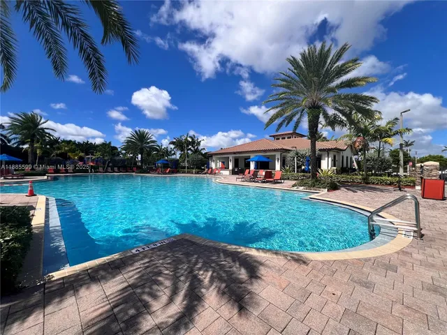 a view of a swimming pool with a patio
