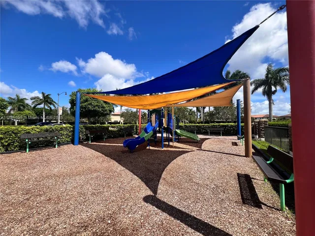 a view of a backyard with sitting area