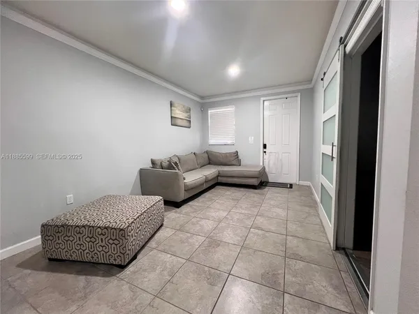 a living room with furniture and a rug