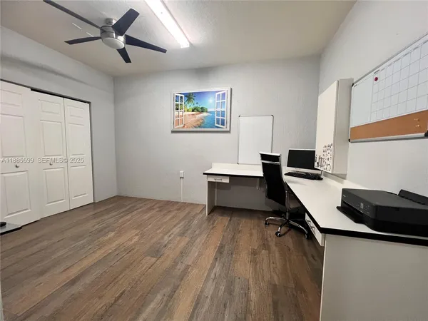 a room with cabinets and wooden floor