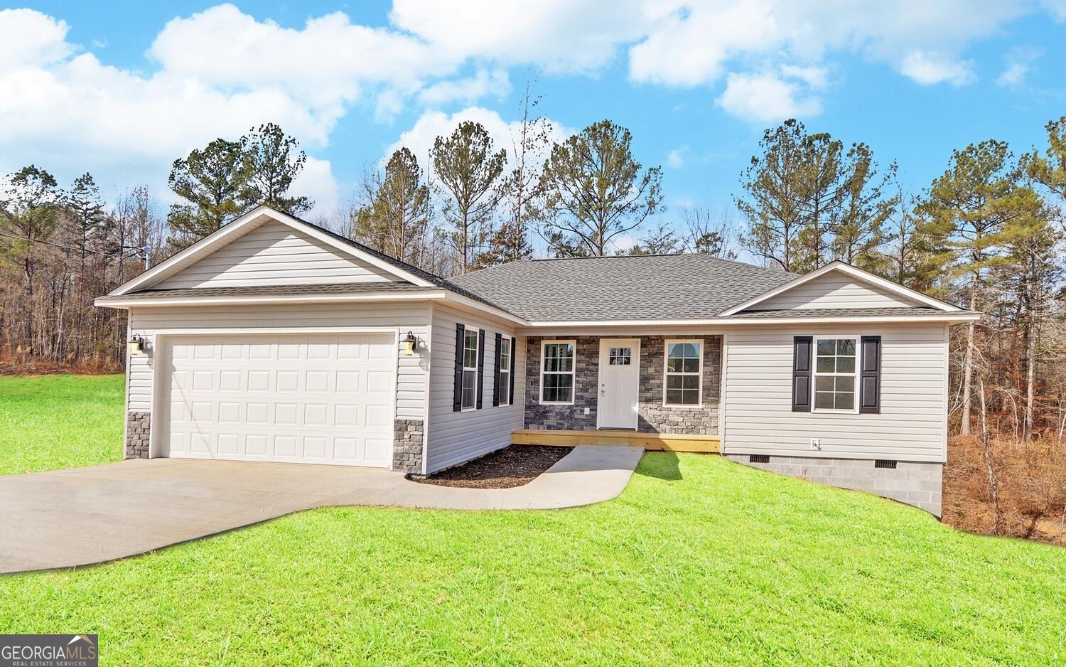 2298 Sunshine Road Toccoa, GA 30577 - Photo 1 of 1 a front view of a house with a yard and garage
