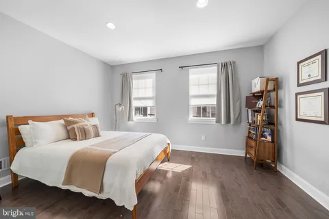 a spacious bathroom with double vanity and a mirror