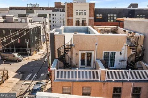 an aerial view of residential houses with outdoor space