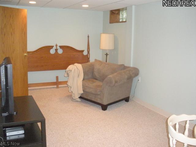 1144 Garman Road Akron, OH 44313 - Photo 10 of 22 Lower level rec room off the kitchen features neutral decor, glass block windows. Great place for the kids to entertain their friends!