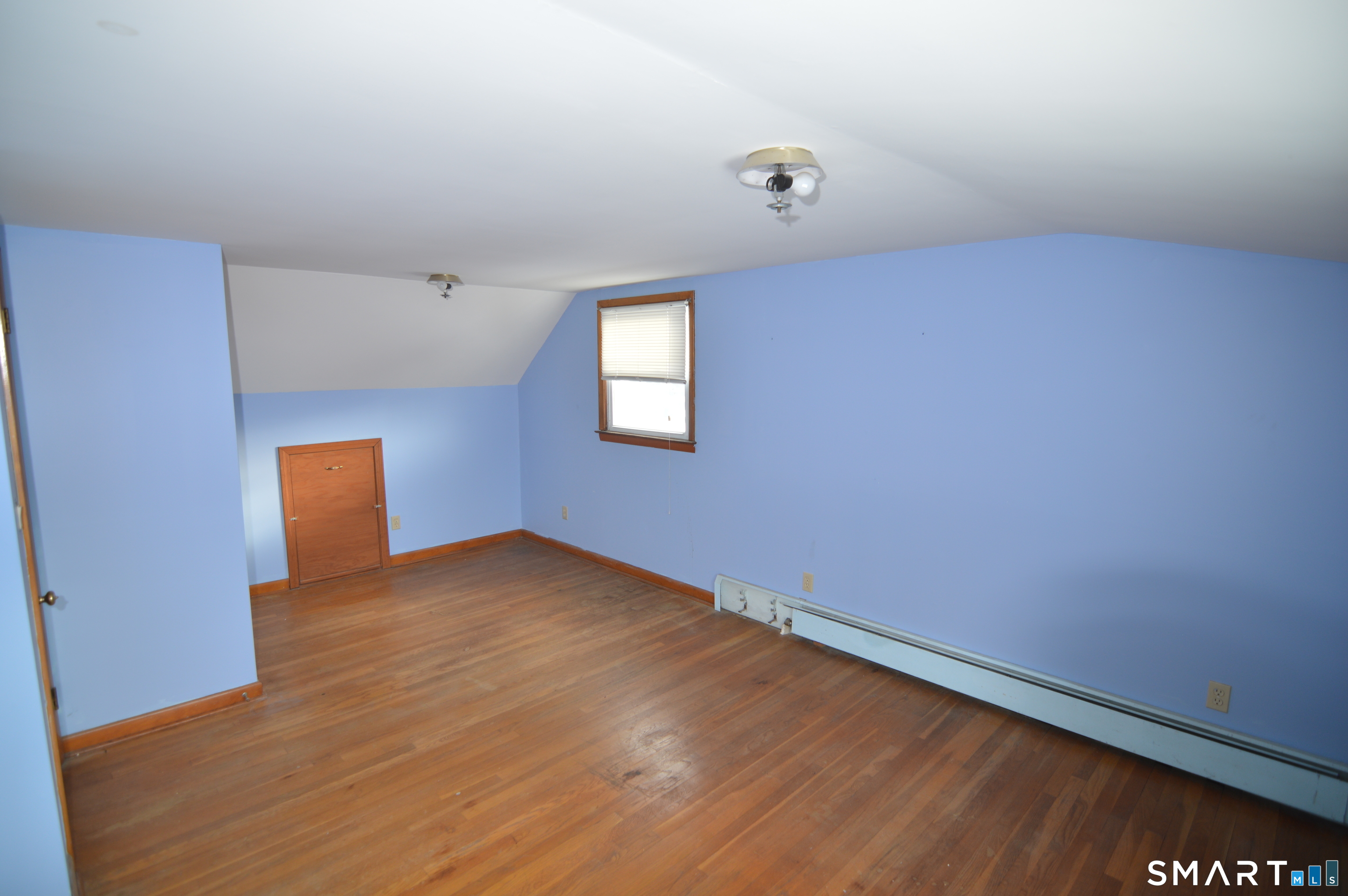 120 Chelsea Street Stratford, CT 06615 - Photo 12 of 17 an empty room with a window