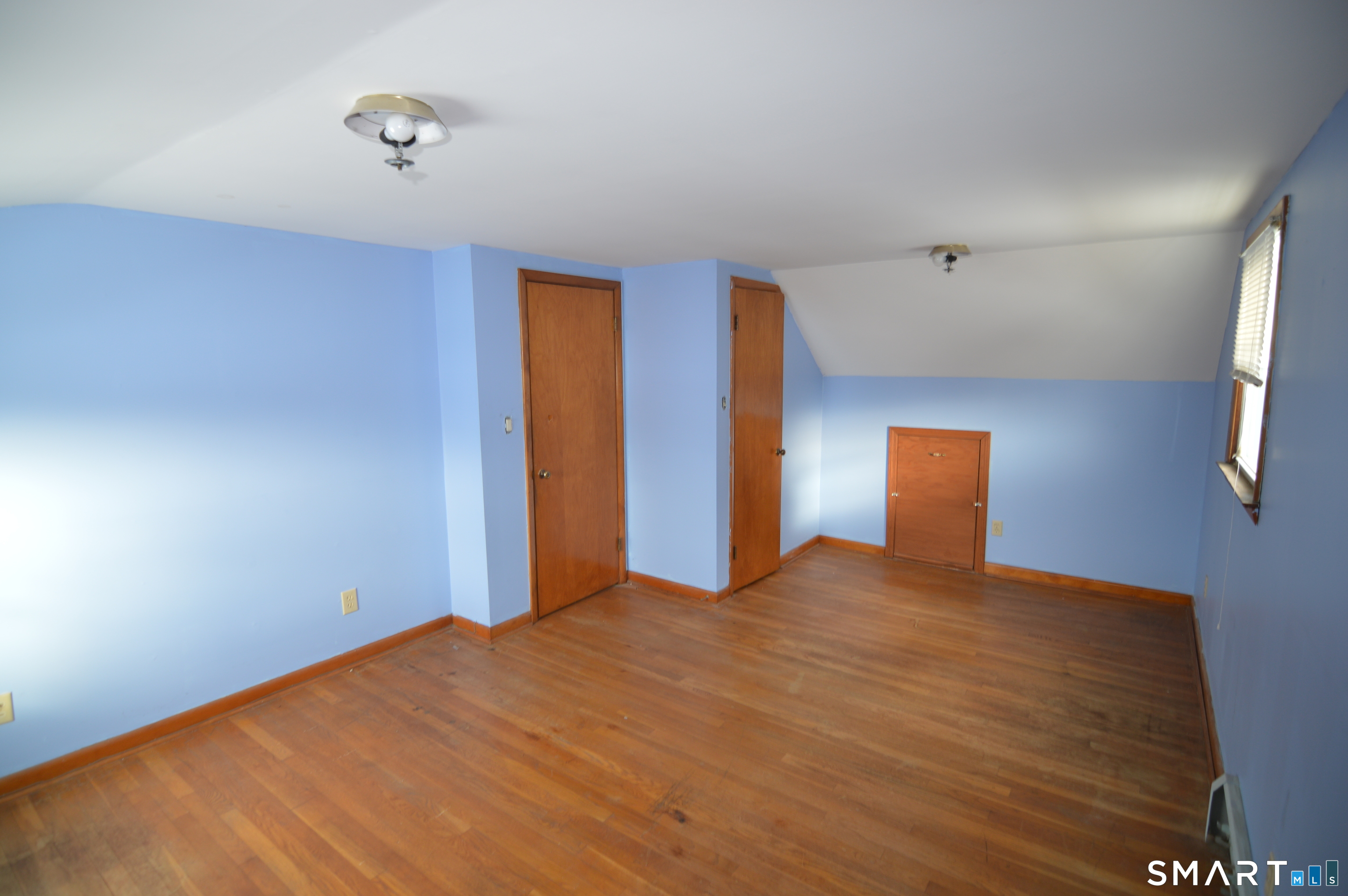 120 Chelsea Street Stratford, CT 06615 - Photo 13 of 17 a view of an empty room with a window