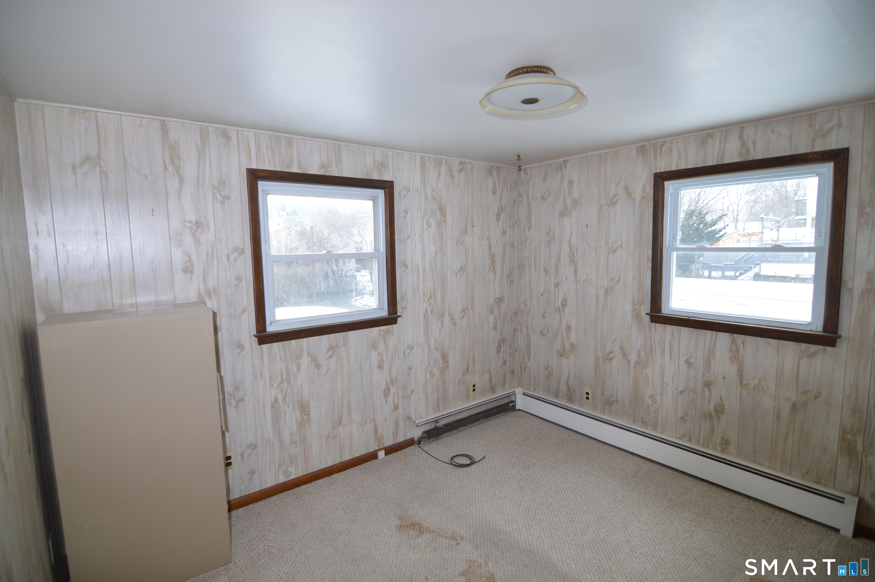 120 Chelsea Street Stratford, CT 06615 - Photo 9 of 17 an empty room with windows