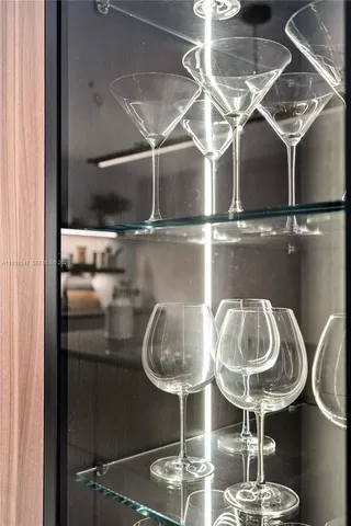 a bedroom with a bed and a night stand