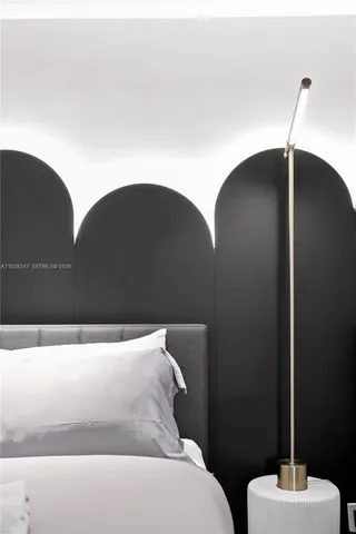 a bed room with bed and large windows