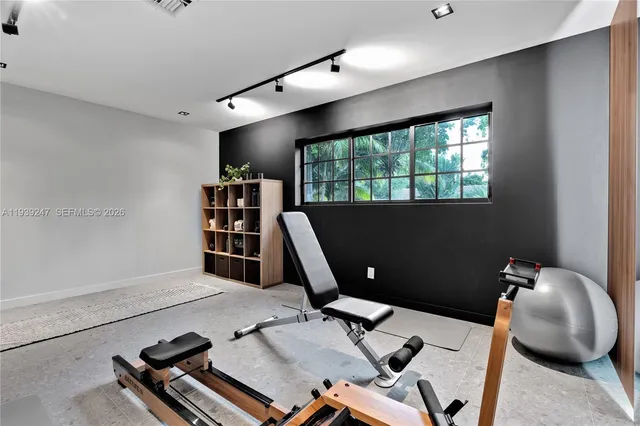 a view of a house with backyard and a patio