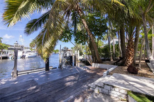 a swimming pool with outdoor seating and yard